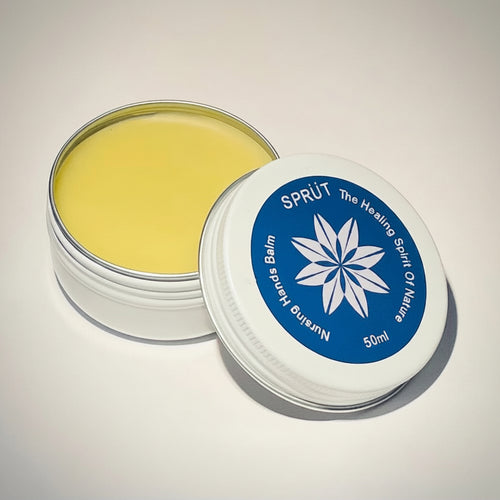 Close up photo of Sprüt Nursing Hands Balm with lid removed showing bright yellow colour and brand logo with text 